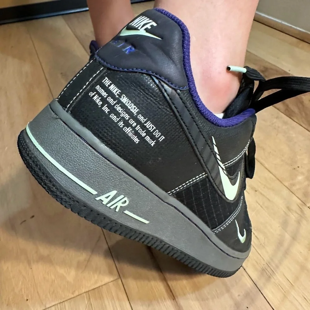 Nike Black and Purple Glow in the dark black AF1s Sneakers.